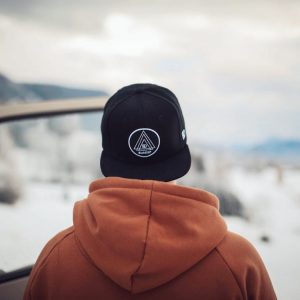 Worker standing by car in Winter