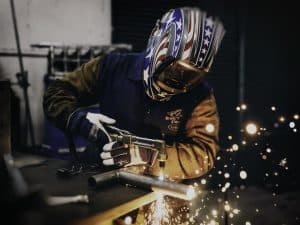 Welder working with metal